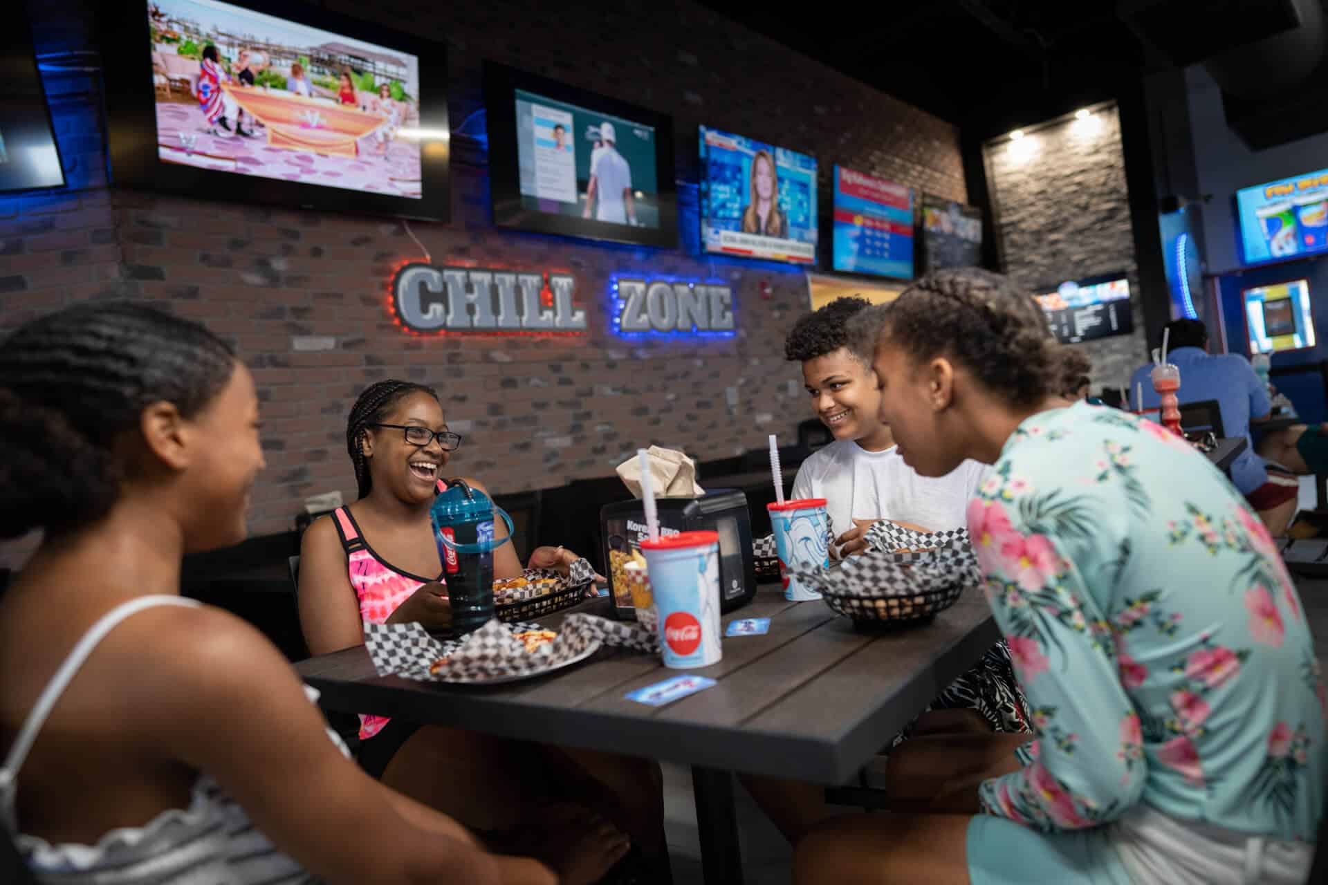 a family dining in the Chill Zone eating area