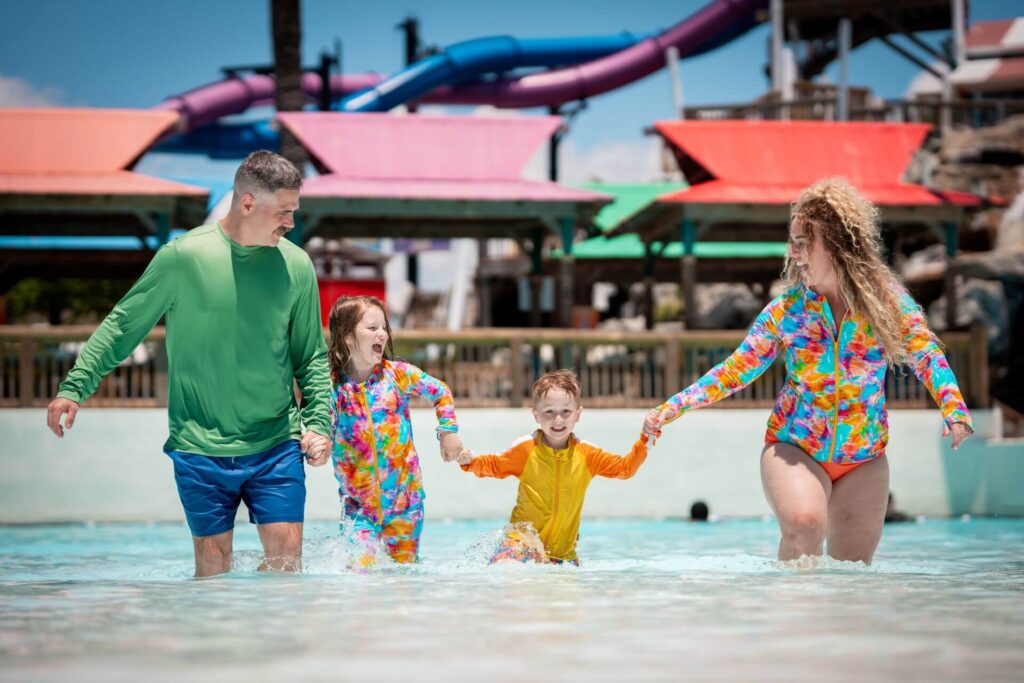 family splashing through the Wave Pool at Big Kahunas