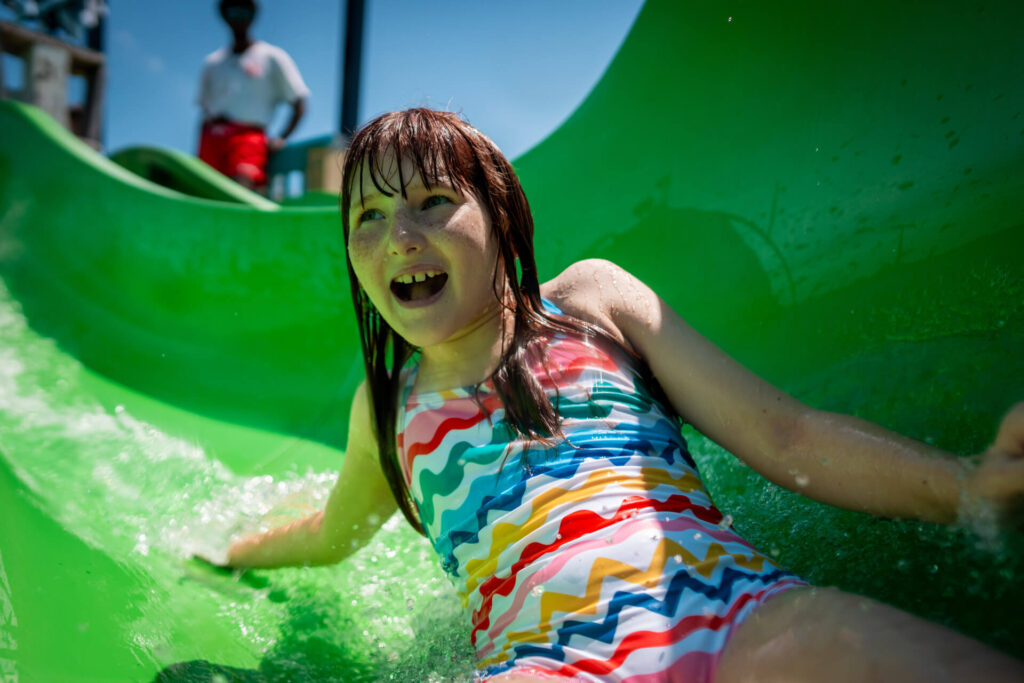 girl on Monkey River water slide at Big Kahunas