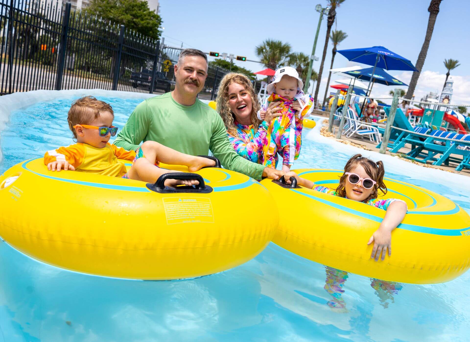 cute family enjoy lazy river at the perfect spot for a family reunion in destin florida